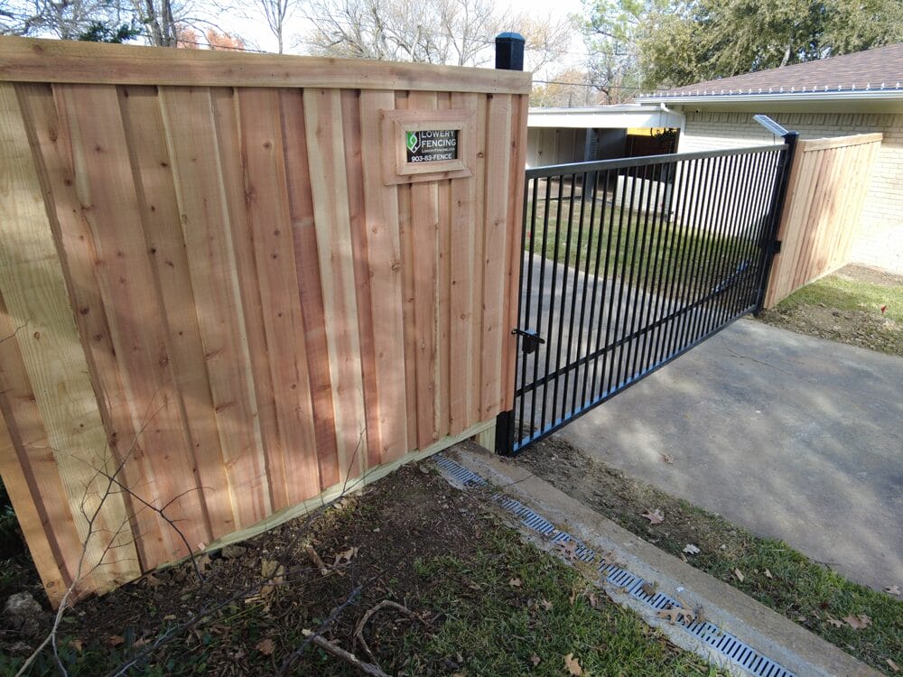 Wrought Iron Gates in Sherman TX Cedar privacy fence with iron driveway gate